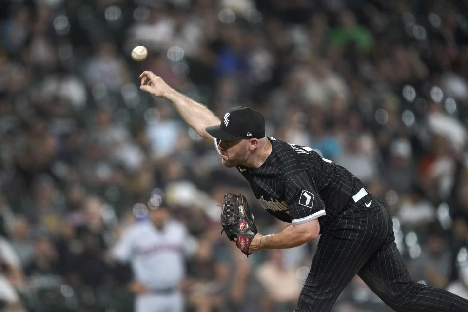 Chicago White Sox relief pitcher Liam Hendriks delivers during the ninth inning of the team's baseball game against the Cleveland Guardians on Tuesday, Sept. 20, 2022, in Chicago. (AP Photo/Charles Rex Arbogast)