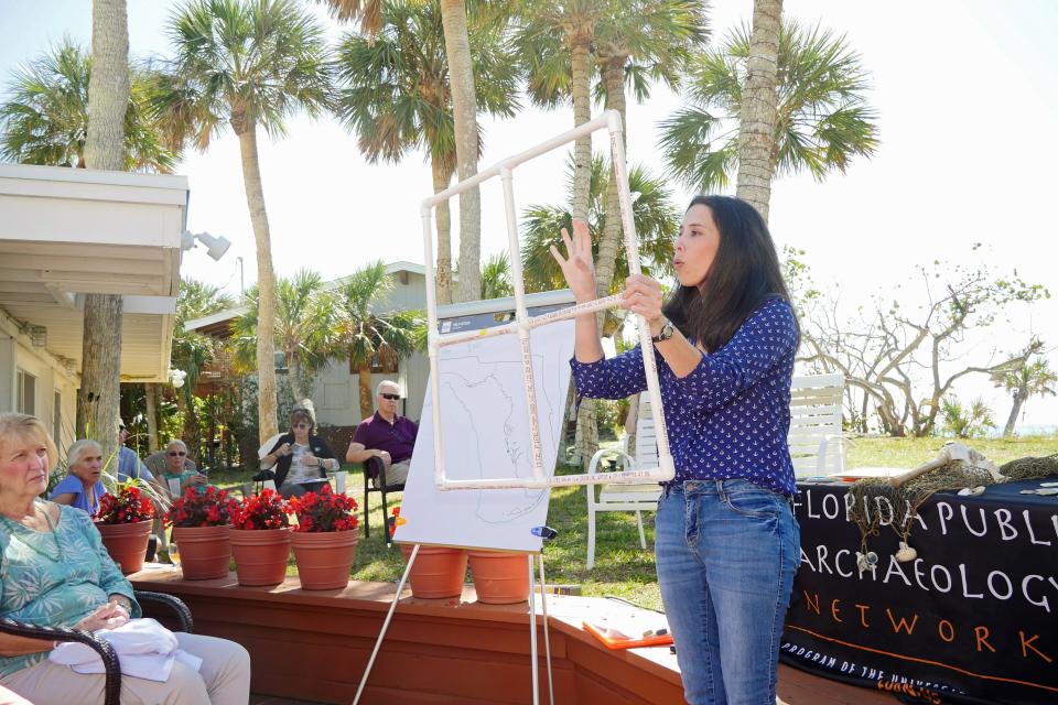 Rachael Kangas, director of west central and central regions for the Florida Public Archaeology Network, shows an audience at the Manasota Beach Club Monthly Lecture Series a structure made of PVC pipes that is used by underwater archaeologists to bracket off a search site.