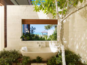<p>If you want to enjoy an alfresco bath in a shady garden just steps from the sand. Parrot Cay is your spot. (Photo: Parrot Cay)</p>