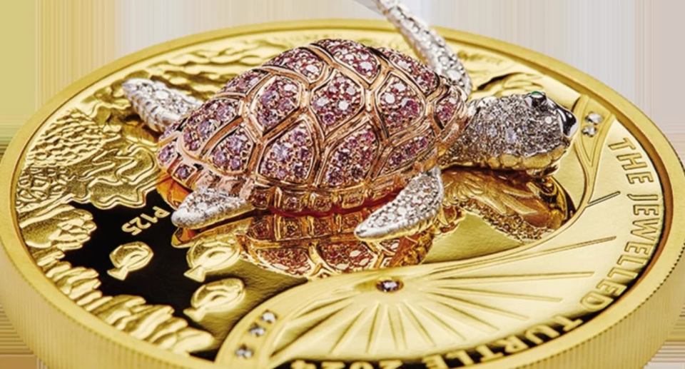 Gold coin with jewel-encrusted turtle on it 