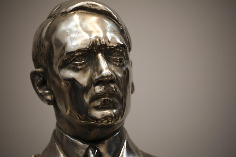 A bust German Nazi leader Adolf Hitler discovered by police in 2017 is displayed at a press conference in Buenos Aires, Argentina, Wednesday, Oct. 2, 2019. Argentine authorities found the cache of Nazi artifacts in a secret room behind a bookcase, and had uncovered the collection in the course of a wider investigation into artwork of suspicious origin found at a gallery in Buenos Aires. (AP Photo/Natacha Pisarenko)