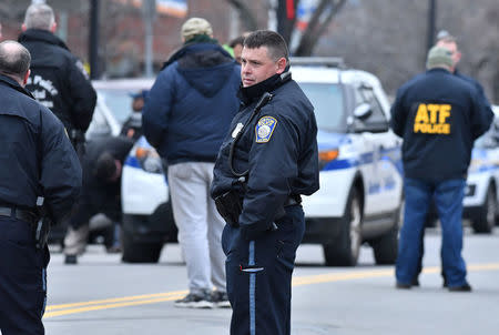 Boston Police gather at the scene after a burning propane tank was left near an unoccupied police cruiser in Boston, Massachusetts, U.S., January 20, 2017. REUTERS/Josh Reynolds