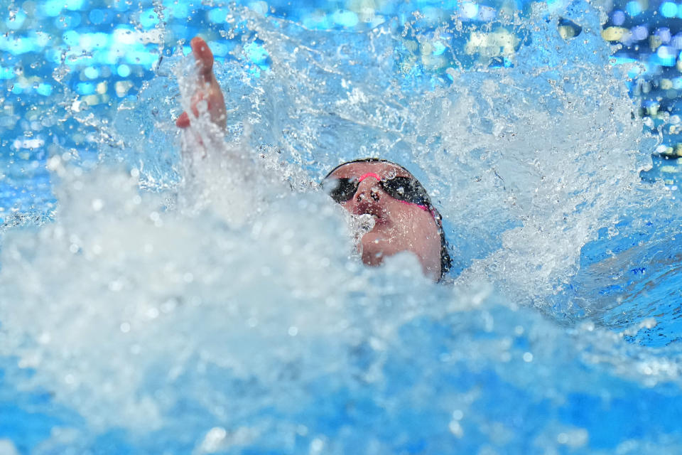 Claire Curzan of the United States competes in the Women's 100m Backstroke Final at the World Aquatics Championships in Doha, Qatar, Tuesday, Feb. 13, 2024. (AP Photo/Hassan Ammar)