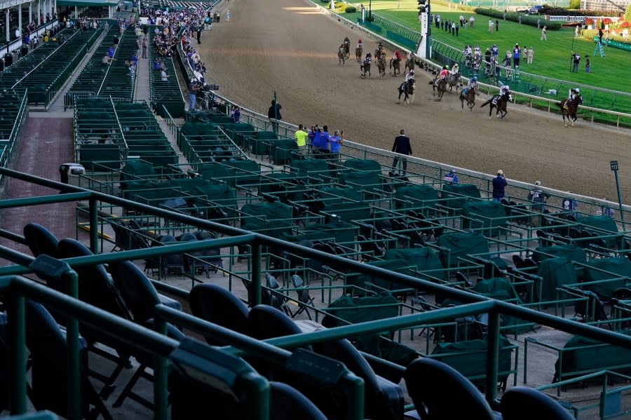 FILE – Jockey John Velazquez riding Authentic, right, leads the field after winning the 146th running of the Kentucky Derby at Churchill Downs in Louisville, Ky., Sept. 5, 2020. The Derby has survived two world wars, the Great Depression, and pandemics, including COVID-19 in 2020, when it ran in virtual silence without the usual crowd of 150,000. (AP Photo/Charlie Riedel, File)