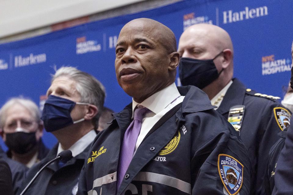 FILE — New York Mayor Eric Adams speaks during the press conference at Harlem Hospital after the shooting of a New York City Police Department officer, in Harlem, Friday, Jan. 21, 2022, in New York. There were unrelenting crises in his first month: a fire ripped through a high-rise apartment building, killing 17 people; a baby was wounded and shot in the face; an officer was wounded and shot in the head; two other officers were fatally shot while responding to a call. (AP Photo/Yuki Iwamura File)