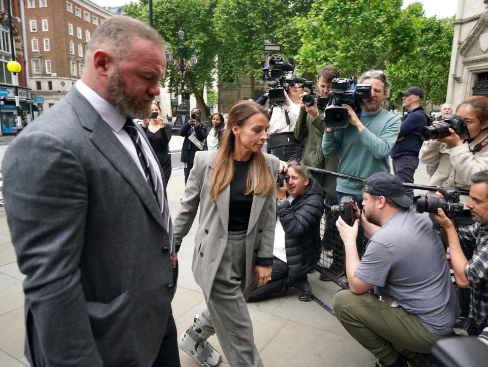 Coleen and Wayne Rooney arrive at the Royal Courts Of Justice (PA)