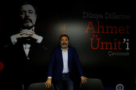 Author Ahmet Umit, 56, who says he will vote 'No', poses in front of his portrait during an international conference about his books, in Istanbul, Turkey April 7, 2017. REUTERS/Umit Bektas