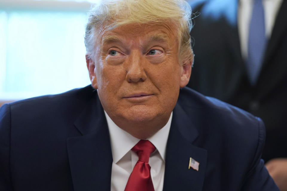 President Donald Trump listens while on a phone call with the leaders of Sudan and Israel, in the Oval Office of the White House, Friday, Oct. 23, 2020, in Washington. (AP Photo/Alex Brandon)