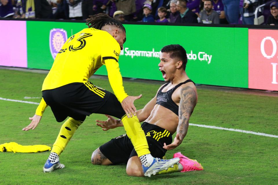 Nov 25, 2023; Orlando, Florida, USA; Columbus Crew forward Cucho Hernández (9) celebrates his goal with defender Mohamed Farsi (23) against Orlando City in the second half of extra time in a MLS Cup Eastern Conference Semifinal match at Exploria Stadium. Mandatory Credit: Morgan Tencza-USA TODAY Sports