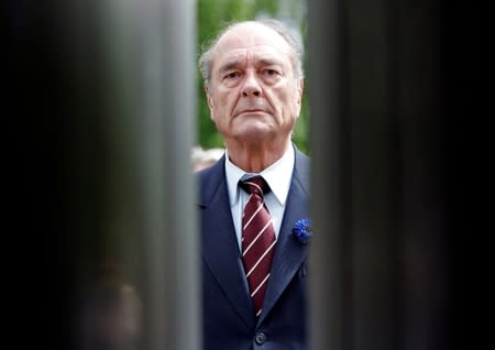 FILE PHOTO: File photo of French President Chirac attending a ceremony to mark Victory Day at the Arc de Triomphe on the Champs Elysees in Paris