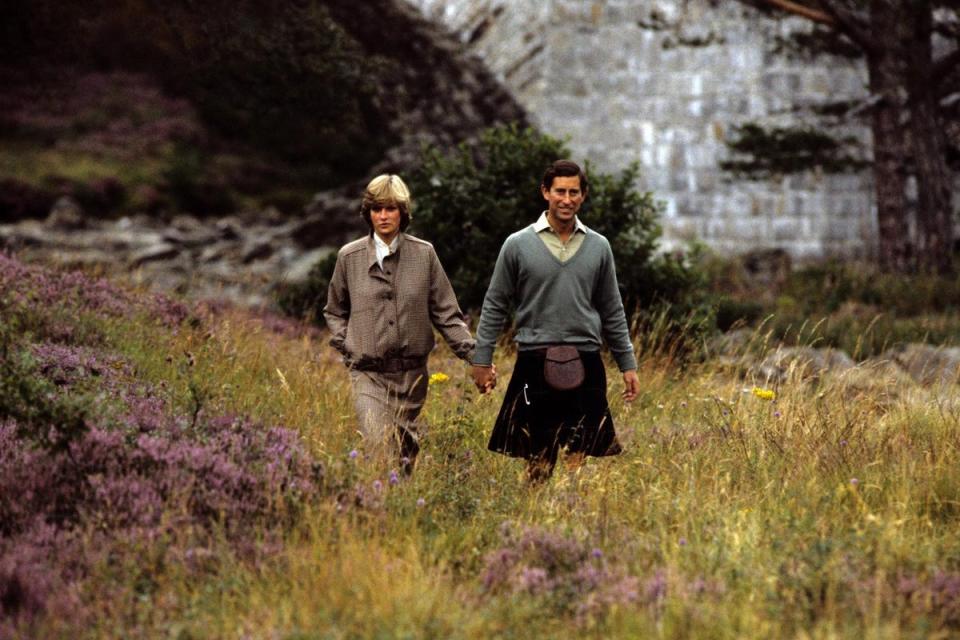 Roaming along the banks of the River Dee, the kilted Prince of Wales with his Princess during their holiday in Scotland while staying at Balmoral Castle (PA Images)