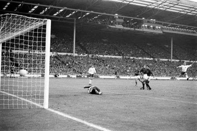Sir Bobby Charlton, right, scores against Portugal in the 1966 World Cup semi-final