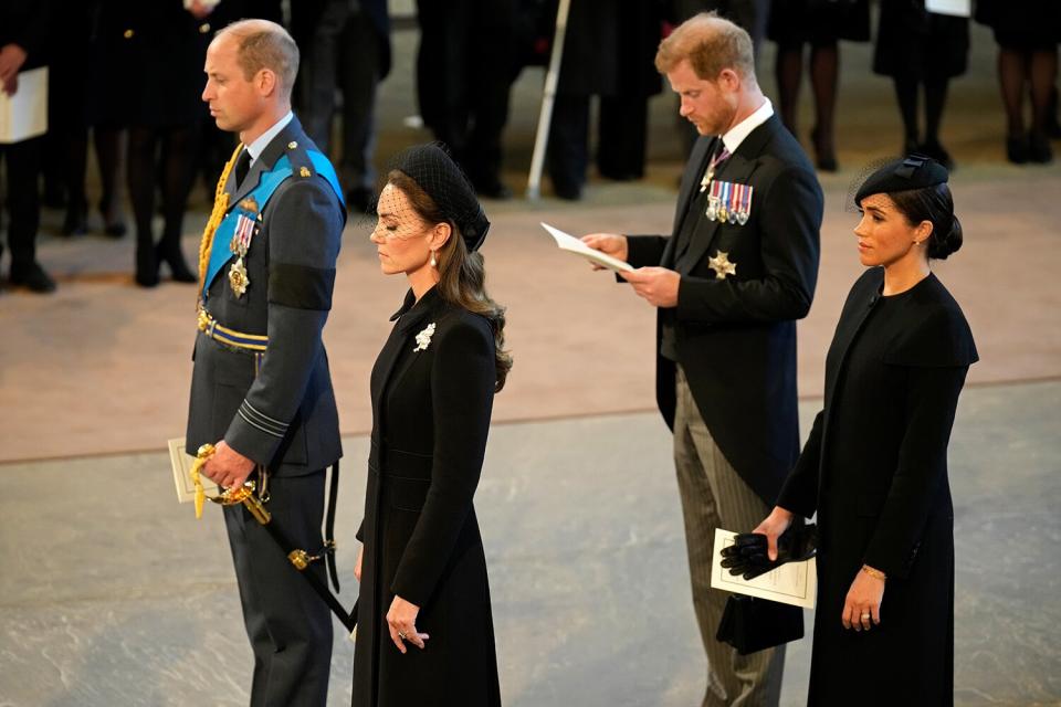 Prince William, Prince of Wales, Catherine, Princess of Wales, Prince Harry, Duke of Sussex and Meghan, Duchess of Sussex seen inside the Palace of Westminster during the Lying-in State of Queen Elizabeth II on September 14, 2022 in London, England.