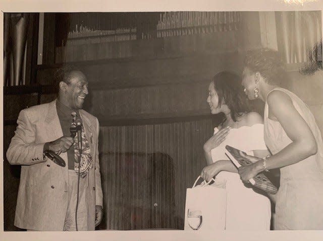 Bill Cosby and Njeri Mathis Rutledge, middle, at Spelman College in May 1993.