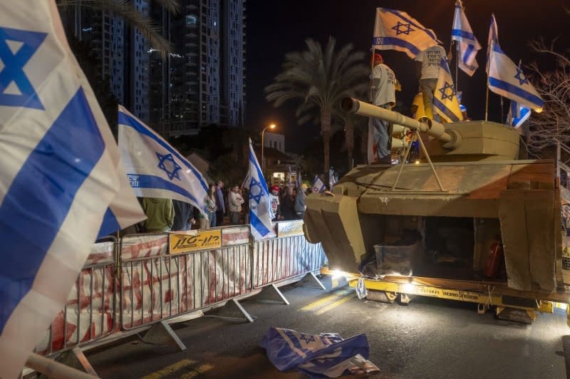 Israeli senior veterans protest for Prime Ministers Benjamin Netanyahu to leave office as they sand atop a cement tank during a mass protest in Tel Aviv calling to oust Prime Minister Benjamin Netanyahu and to bring the hostages held by Hamas home. Photo by Jim Hollander/UPI
