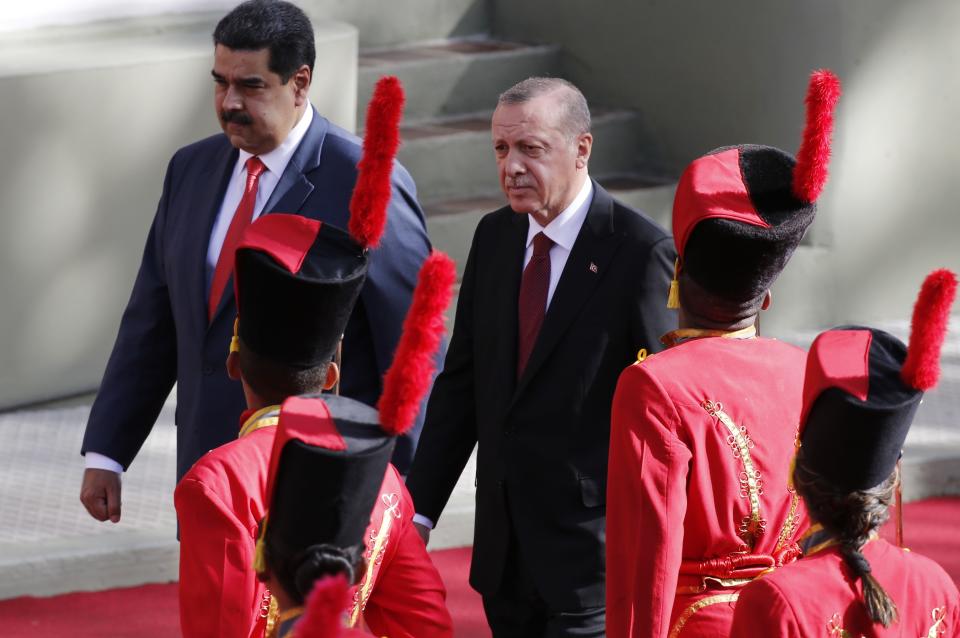 Venezuela's President Nicolas Maduro receives Turkey's President Recep Tayyip Erdogan at the Miraflores Presidential Palace in Caracas, Venezuela, Monday, Dec. 3, 2018. Erdogan is on a one-day official visit to the country. (AP Photo/Ariana Cubillos)