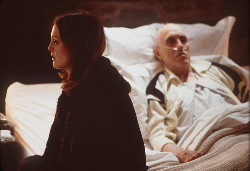 Julianne Moore sitting on the edge of Robards' hospital bed in Magnolia