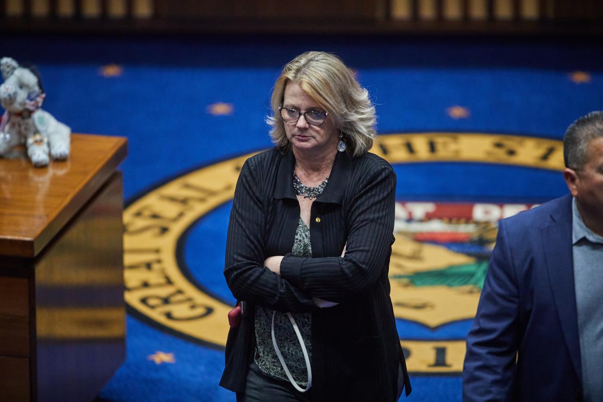 State Sen. Kelly Townsend (R-D16) walks toward the exit of the Senate chamber after the Senate adjourned for the night in the Arizona State Senate chambers in Phoenix on June 23, 2022.