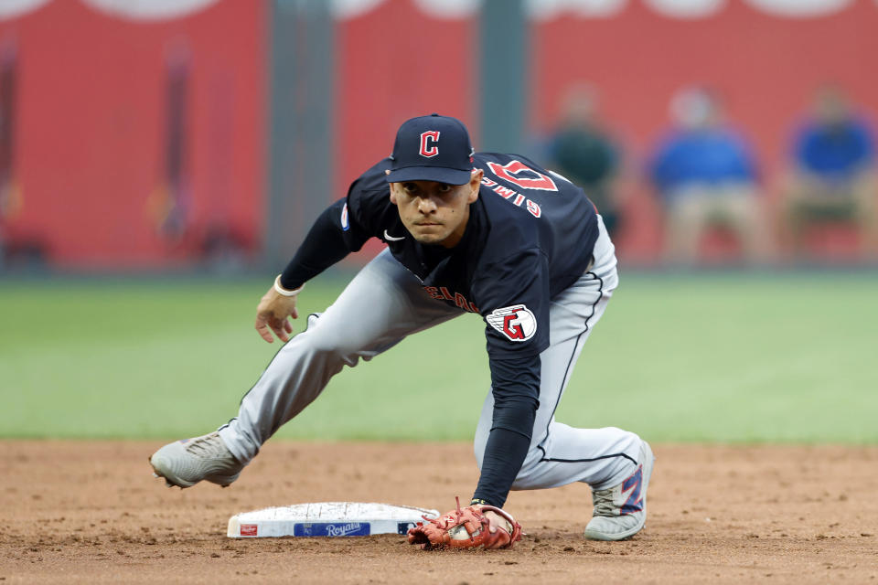 Cleveland Guardians second baseman Andrés Giménez looks toward first base after catching the throw from an outfielder to hold Kansas City Royals' Hunter Renfroe to a single during the third inning of a baseball game in Kansas City, Mo., Thursday, June 27, 2024. (AP Photo/Colin E. Braley)