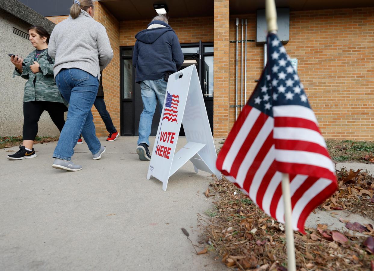 Voters head in and out of precinct one at Commerce Elementary School in Commerce Township on Election Day on Tuesday, Nov 8, 2022.