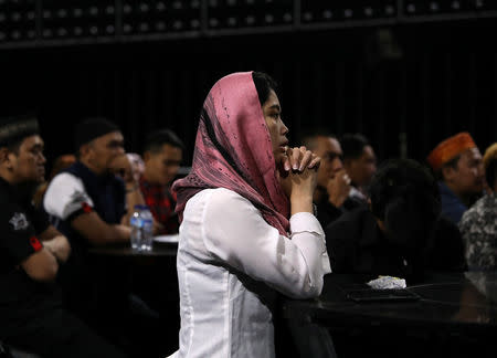 Staff at Boshe VVIP Club listen to a sermon by Mifta'im An'am Maulana Habiburrohman, or Gus Miftah, a 37-year-old Muslim preacher who aims to create a safe space to worship for those who work in the entertainment industry, in Kuta, Bali, Indonesia November 27, 2018. REUTERS/Nyimas Laula/Files