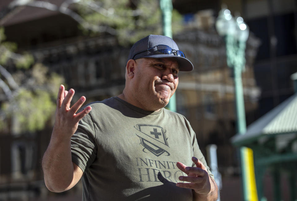 Albert Hernandez, who lost his sister Maribel Loya and brother-in-law Leo Campos in the August 2019 Walmart mass shooting, speaks to the media outside the federal court in El Paso, Texas, Wednesday, Feb. 8, 2023. Patrick Crusius pleaded guilty Wednesday to federal charges accusing him of killing nearly two dozen people in a racist attack, changing his plea weeks after the U.S. government said it wouldn't seek the death penalty for the hate crimes and firearms violations. (AP Photo/Andrés Leighton)