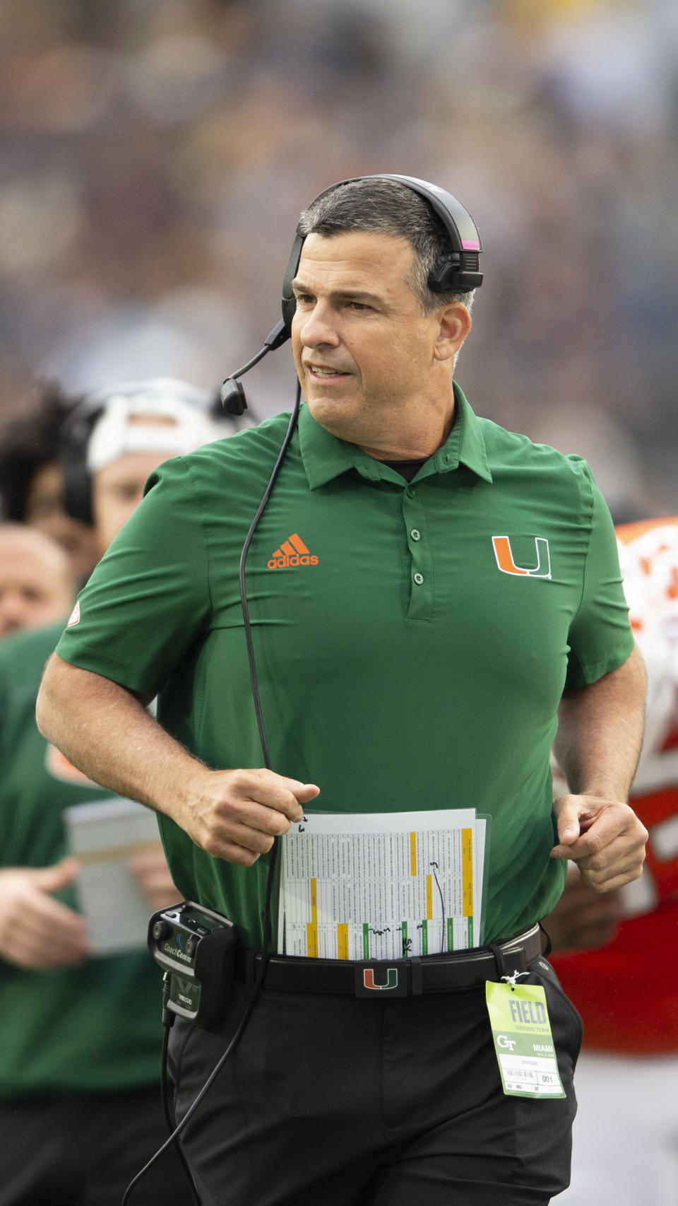 Miami head coach Mario Cristobal runs onto the field in the first half of an NCAA college football game against Georgia Tech, Saturday, Nov. 12, 2022, in Atlanta. (AP Photo/Hakim Wright Sr.)