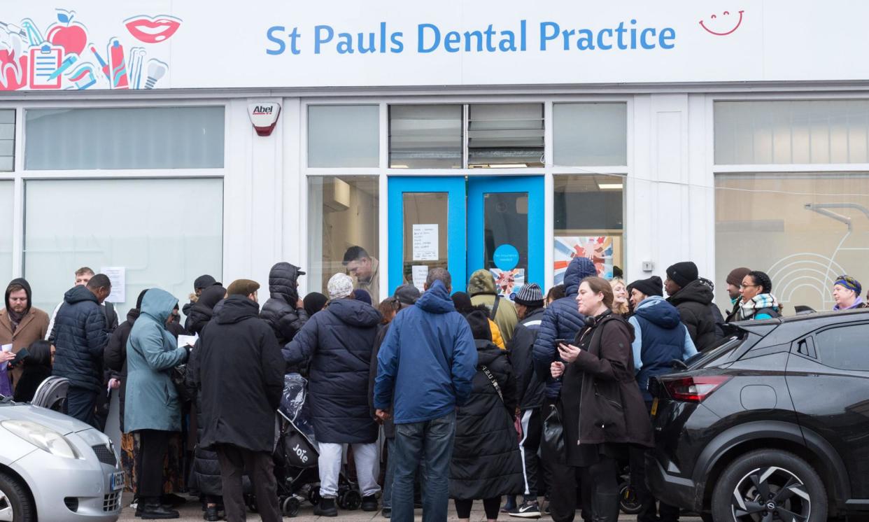 <span>People queueing to register at a dentistry practice in Bristol last week.</span><span>Photograph: Simon Chapman/LNP</span>