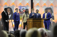 A University of Virginia football player speaks during a memorial service for three slain University of Virginia football players Lavel Davis Jr., D'Sean Perry and Devin Chandler at John Paul Jones Arena at the school in Charlottesville, Va., Saturday, Nov. 19, 2022. (AP Photo/Steve Helber, Pool)