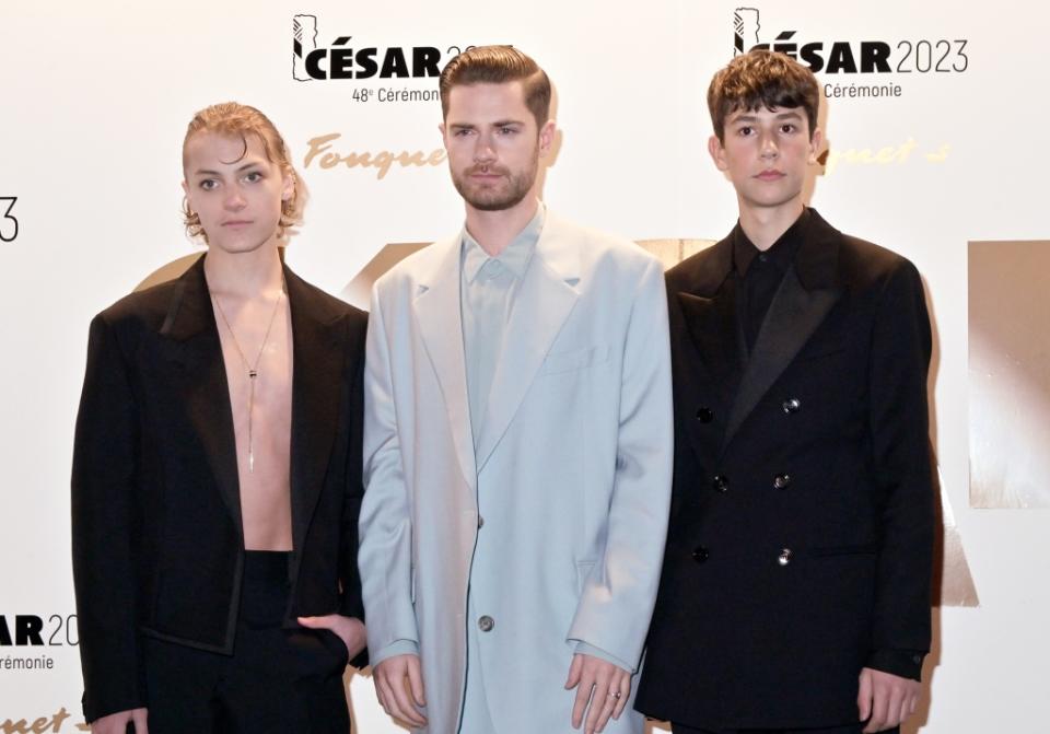 PARIS, FRANCE - FEBRUARY 24: (L-R) Eden Dambrine, Lukas Dhont and a comedian attend the photocall during the 48th Cesar Film Awards at Le Fouquet's on February 24, 2023 in Paris, France. (Photo by Foc Kan/WireImage)