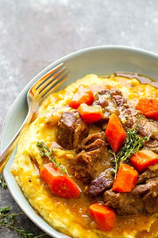 <p>Whole & Heavenly Oven</p><p>Saucy and incredibly tender stout braised beef short ribs are piled high over creamy bowls of mascarpone polenta for the ultimate comfort food!</p><p><strong>Get the recipe: </strong><a href="https://wholeandheavenlyoven.com/2019/12/09/stout-braised-beef-short-ribs-with-mascarpone-polenta/?fbclid=IwAR1h9-NkjKjpq9WsL6kxffp0rlkev31yFZlPC845nbeqRODJItSCrU-NsDo" rel="nofollow noopener" target="_blank" data-ylk="slk:Stout Braised Beef Short Ribs with Mascarpone Polenta;elm:context_link;itc:0;sec:content-canvas" class="link rapid-noclick-resp"><strong>Stout Braised Beef Short Ribs with Mascarpone Polenta</strong></a></p>