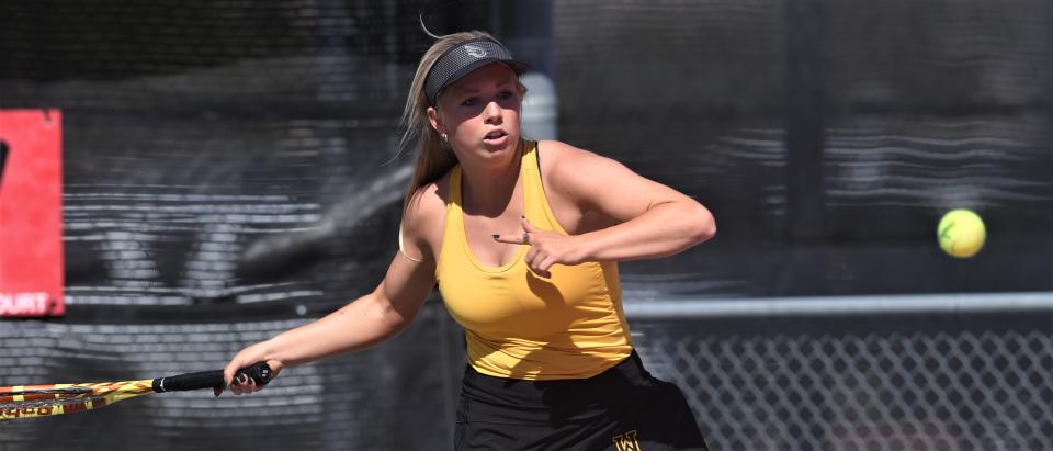 Wylie's Carly Bontke eyes the ball during her mixed doubles match against Scott Mason and Bryanna Orr of Aledo. Bontke and Marshall McPherson beat the Aledo team 6-3, 6-1 in Region I-5A quarterfinals Monday at the McLeod Tennis Center in Lubbock.