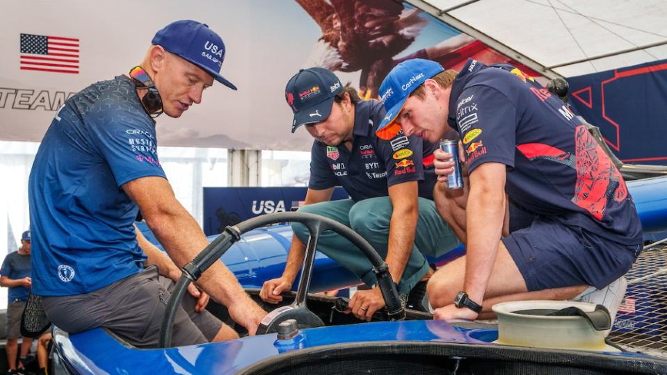Verstappen and Pérez being shown the 50-foot cat’s wheel by US driver Jimmy Spithill. - Credit: Courtesy SailGP