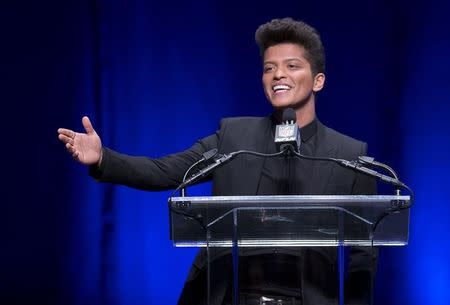 Singer Bruno Mars speaks at the Super Bowl half time press conference in New York January 30, 2014. REUTERS/Carlo Allegri