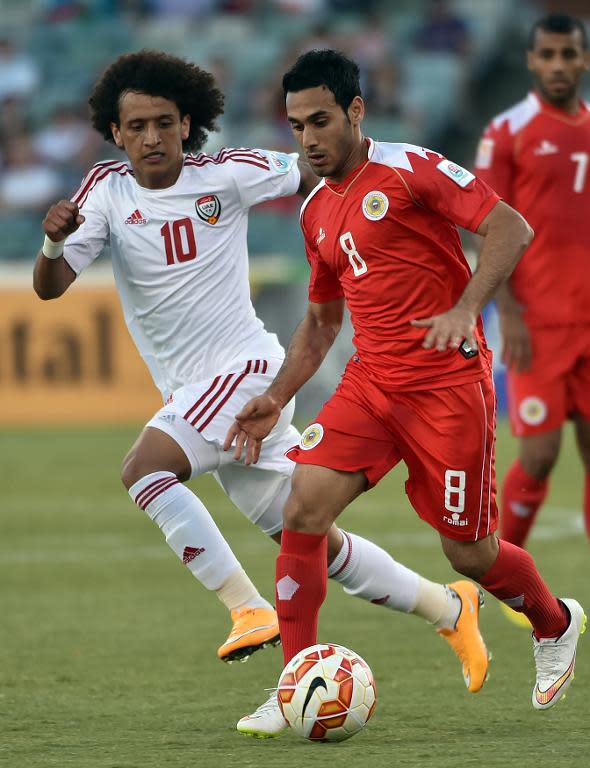 Omar Abdulrahman (left) clashes with Sayed Ahmed during the Asian Cup game between Bahrain and UAE in Canberra on January 15, 2015
