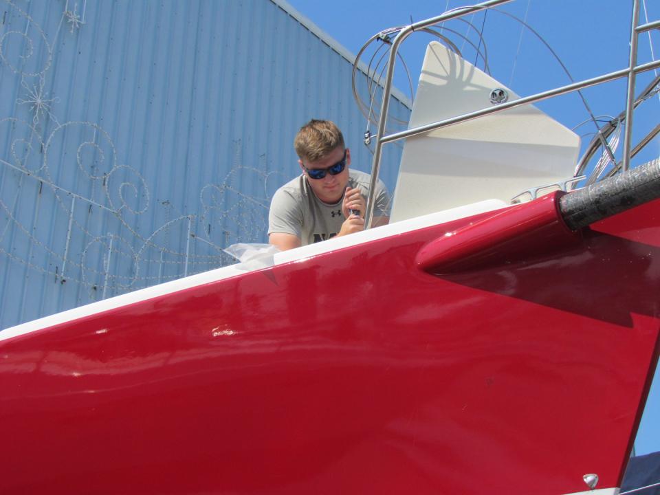 Nate Bramwell working on the Avenger's bow at Desmond Marine on July 10, 2023.