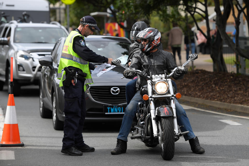 Police stop motorists crossing the Qld-NSW border to check to for permits at Griffith Street checkpoint at Coolangatta on the Gold Coast. Source: AAP