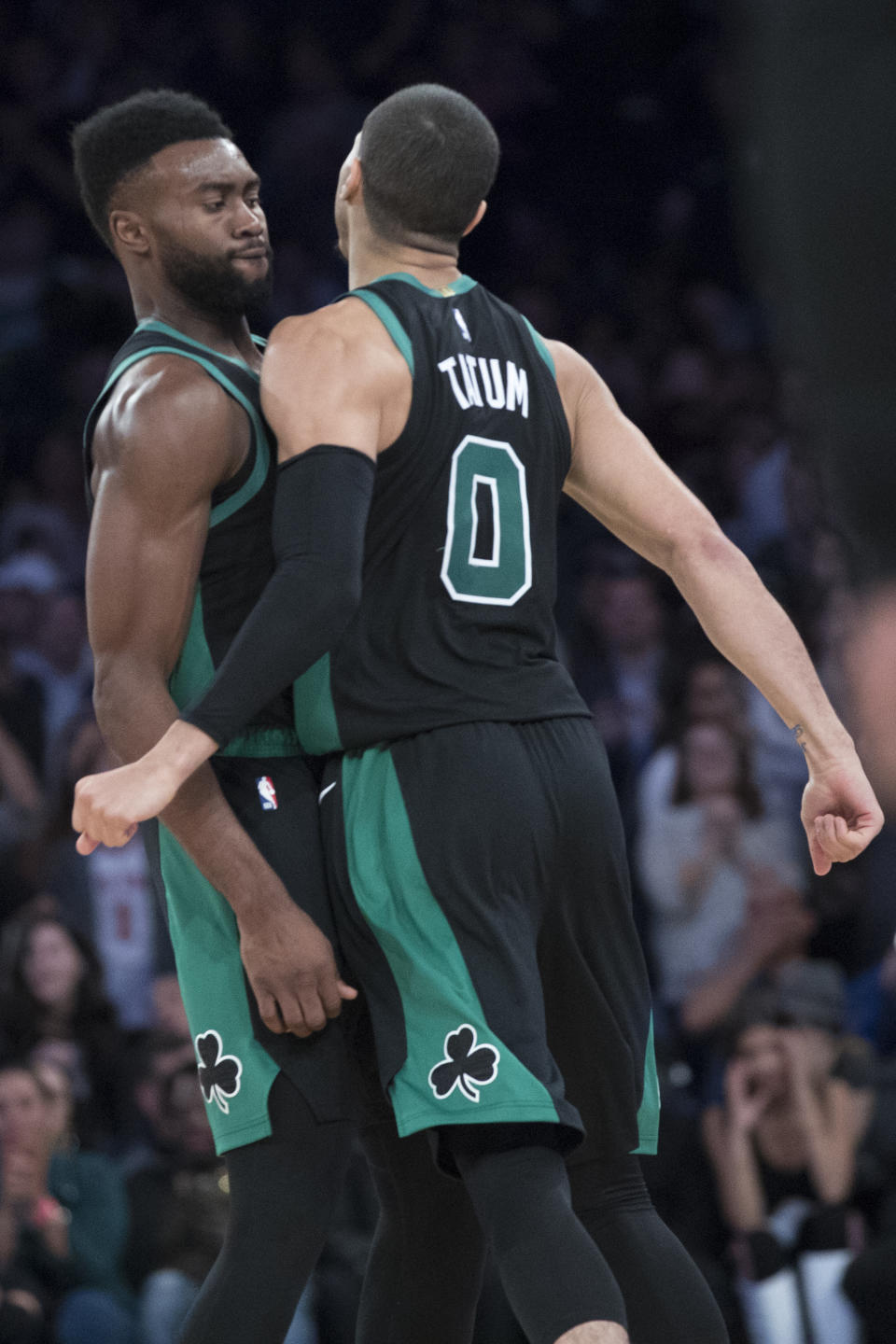 Boston Celtics forward Jayson Tatum (0) and forward Jaylen Brown celebrate after Tatum scored the winning goal during the second half of an NBA basketball game New York Knicks, Saturday, Oct. 20, 2018, at Madison Square Garden in New York. (AP Photo/Mary Altaffer)