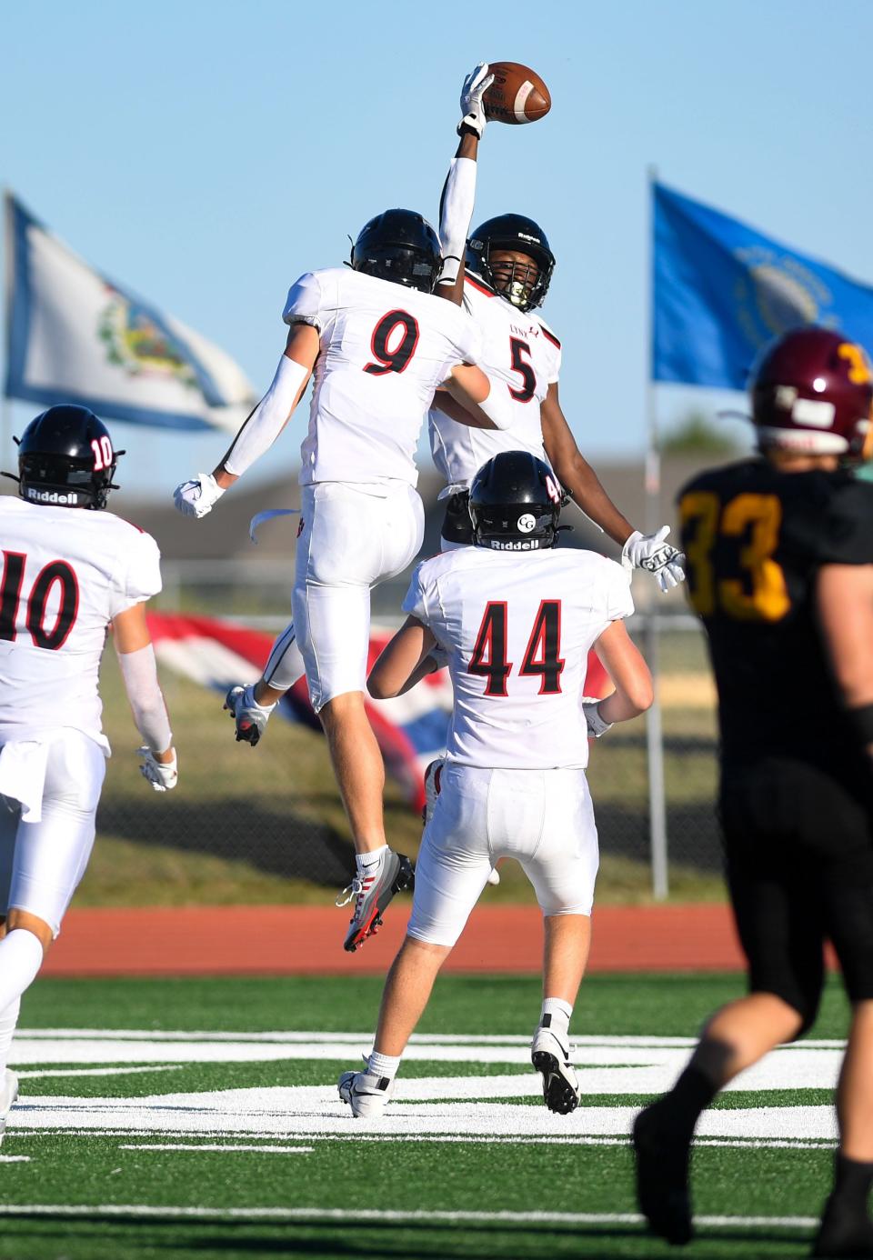 Brandon Valley's Dveyoun Bonwell-Witte and Nate Andresen celebrate a touchdown on Friday, September 2, 2022, at Harrisburg High School.