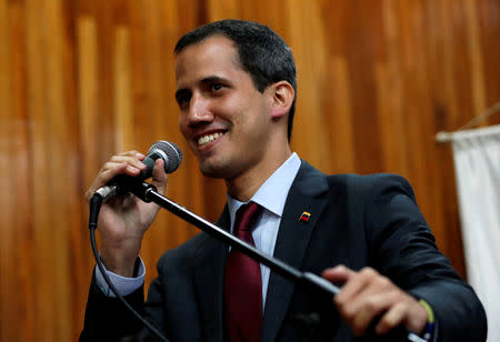 FILE PHOTO: Venezuelan opposition leader Juan Guaido speaks during a meeting with representatives of FEDEAGRO, the Confederation of Associations of Agricultural Producers of Venezuela, in Caracas, Venezuela February 6, 2019. REUTERS/Carlos Garcia Rawlins/File Photo