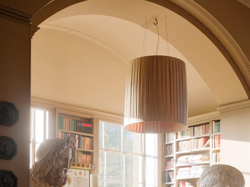 A room with a large boho-style light fixture