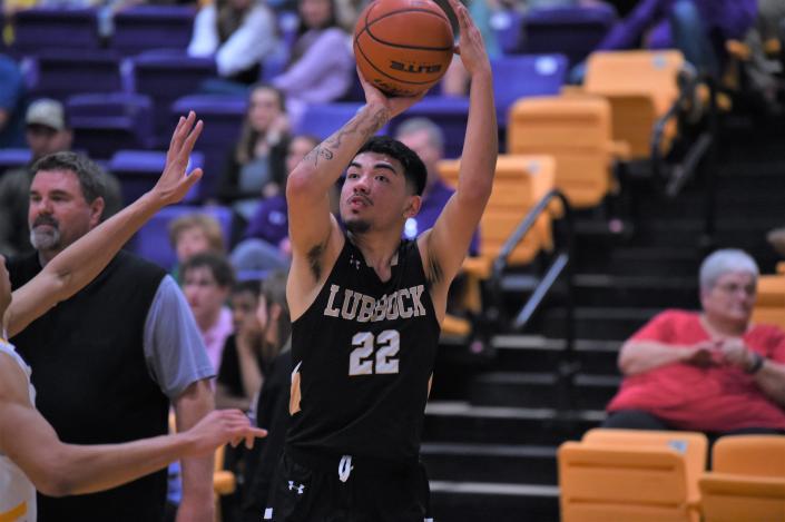 Lubbock High&#39;s Chirs Morales (22) shoots a 3-pointer during Tuesday&#39;s game against Wylie. The Westerners lost 66-57, falling to 0-2 in District 4-5A play.