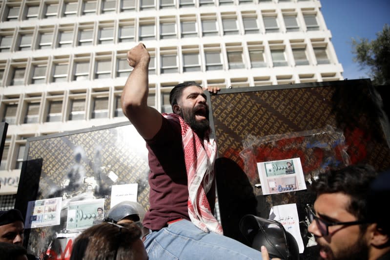 A protester shouts slogans at a demonstration outside of Lebanon Central Bank during ongoing anti-government protests in Beirut
