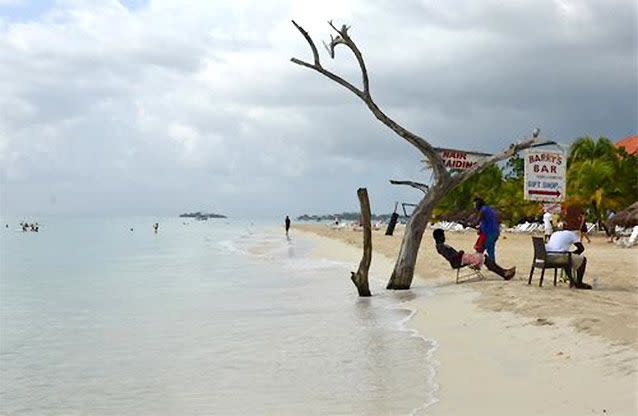 The tide gnaws away at a badly eroding patch of Seven Mile Beach in Negril. Source: AP Photo