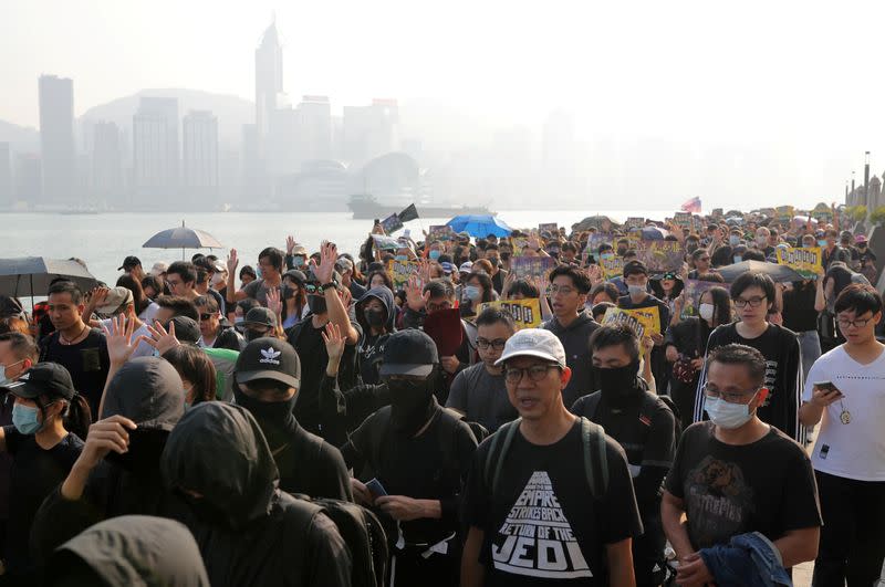 Anti-government protesters march during the "Lest We Forget" rally in Hong Kong