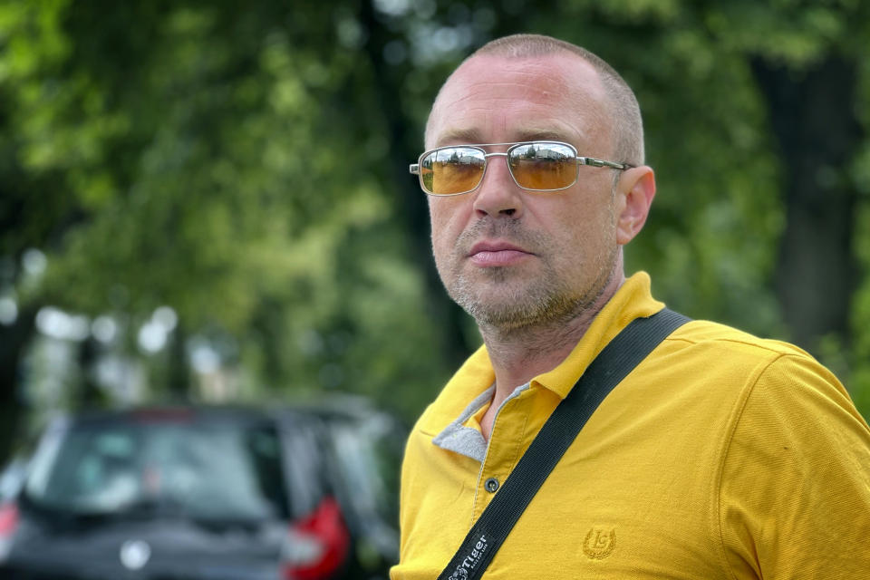 FILE - Ivan Skyba poses for a photo in Katowice, Poland, on July 16, 2022. Skyba, a taxi driver, volunteered at a Ukrainian checkpoint in Bucha, Ukraine. Russian soldiers captured Skyba and other volunteers during a March 4 sweep. Skyba was tortured and narrowly survived an execution by pretending to be dead. Asked “What would justice be for you?,” he says, "Close them down in Russia so that they don’t crawl to us. Not to have Russians. It’d be justice. That’s it. I’d like the West to give us more weapons so that we can get them out of Ukraine." (AP Photo/Erika Kinetz, File)