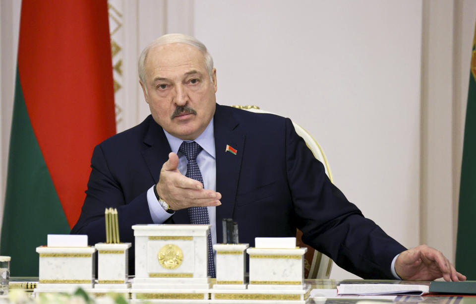 Belarusian President Alexander Lukashenko leads a cabinet meeting in Minsk, Belarus, Friday, Oct. 22, 2021. Belarusian authorities on Friday abolished mask mandates less than two weeks after their introduction for the first time in the pandemic, after Lukashenko dismissed them as unnecessary even as the country faced a spike in contagion. (Nikolay Petrov/BelTA Pool Photo via AP)