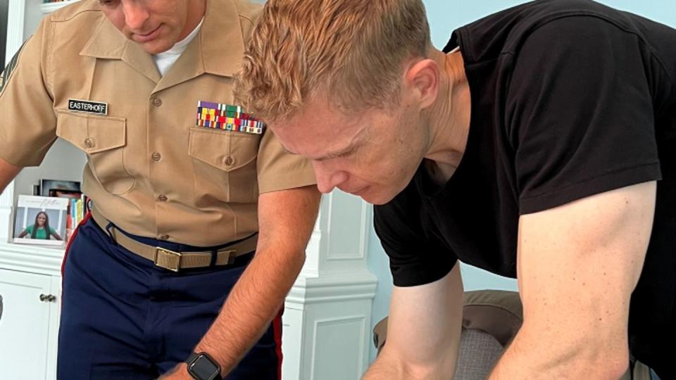 Sgt. William Treseder signs his reenlistment paperwork in Madison, New Jersey, in September 2022. (Sgt. William Treseder)