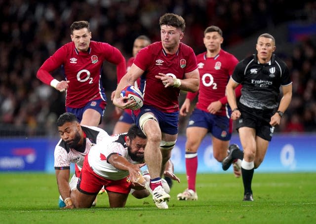Tom Curry (centre) in action for England