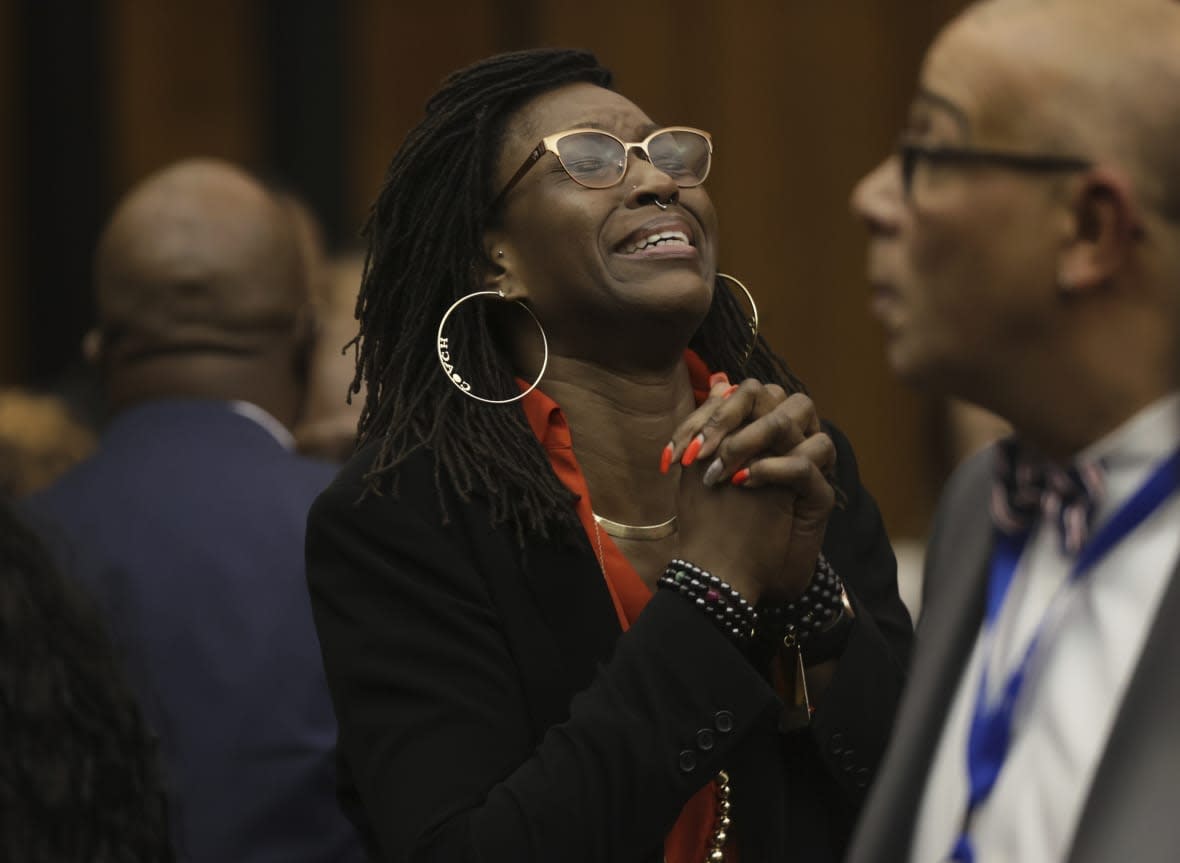 Erika Barrow, former girlfriend to Lamar Johnson, reacts on Tuesday, Feb. 14, 2023, after St. Louis Circuit Judge David Mason vacated his murder conviction during a hearing in St. Louis, Mo. (Christian Gooden/St. Louis Post-Dispatch via AP, Pool)